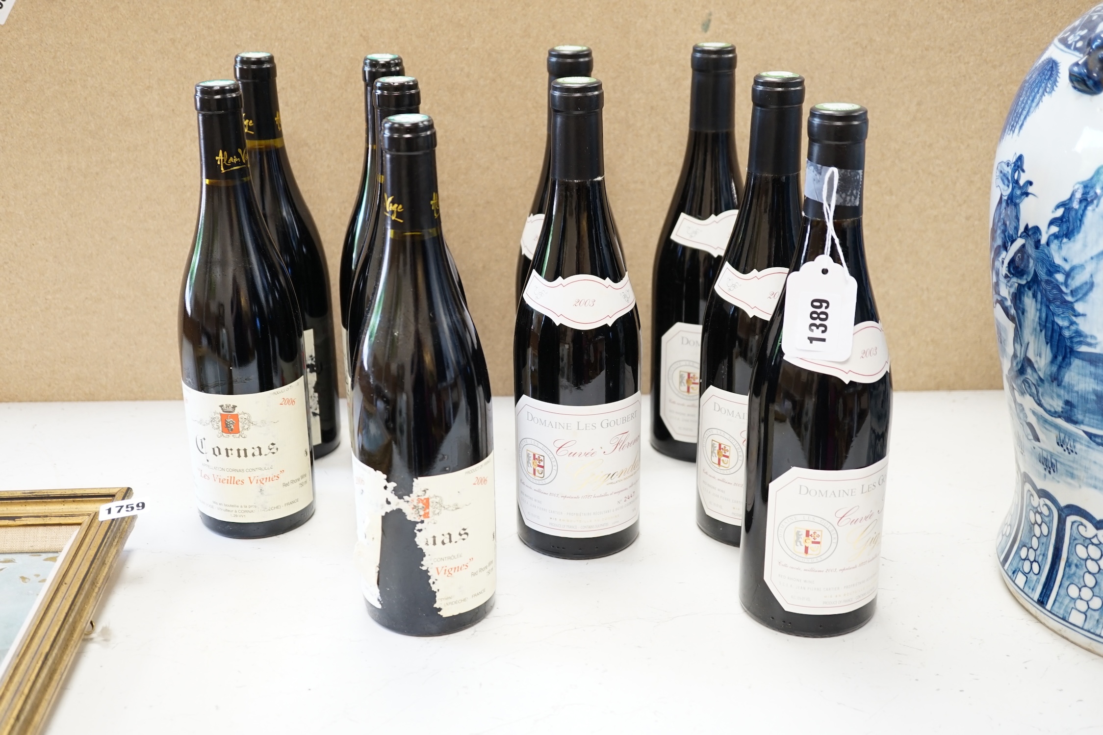 Twelve bottles of wine to include six bottles of Domaine Les Goubert Cuvee Florence Gigondas 2003, and six bottles of Cornas Les Vieilles Vignes 2006. Condition - fair to good, storage history unknown, some wear to the l